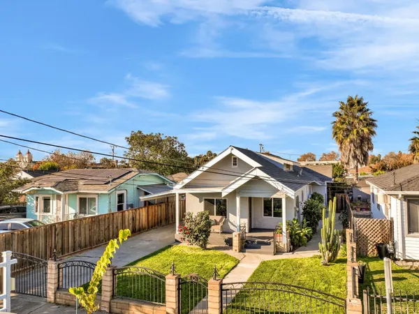 a living room with furniture a rug and a window
