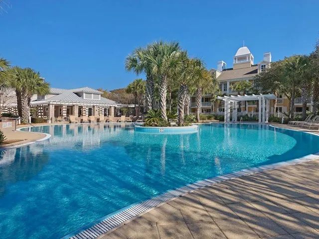 a view of a lake with a house in the background
