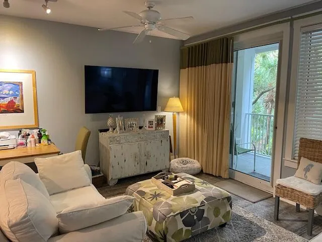 a bedroom with furniture and a flat screen tv