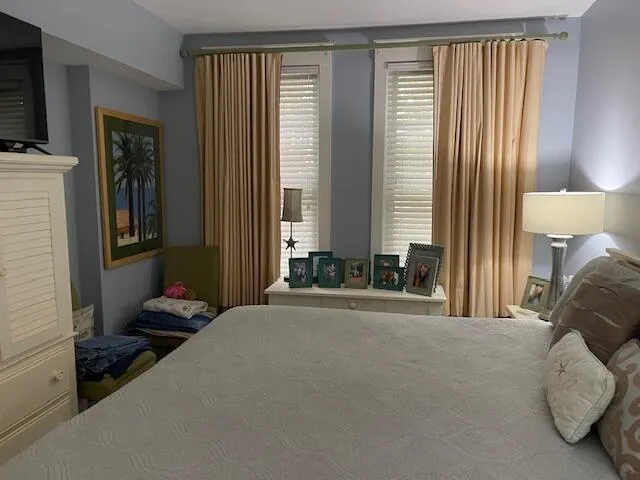 a bedroom with a bed and walk in closet