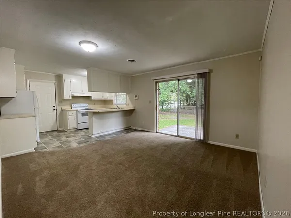 a view of a kitchen with a stove top oven