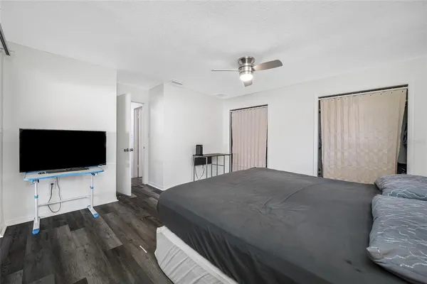 a living room with a bed furniture and a window