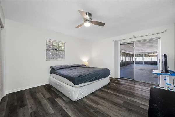 a living room with a bed furniture and a window