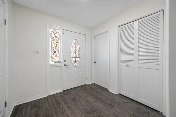 a room with furniture and wooden floor
