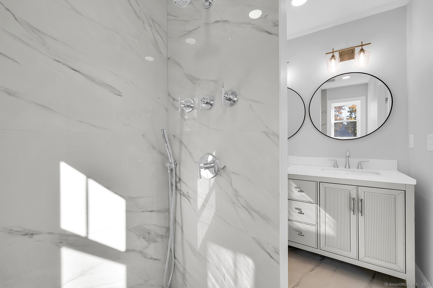 183 Vesper Street Fairfield, CT 06825 - Photo 13 of 21 a bathroom with a sink a vanity and a mirror