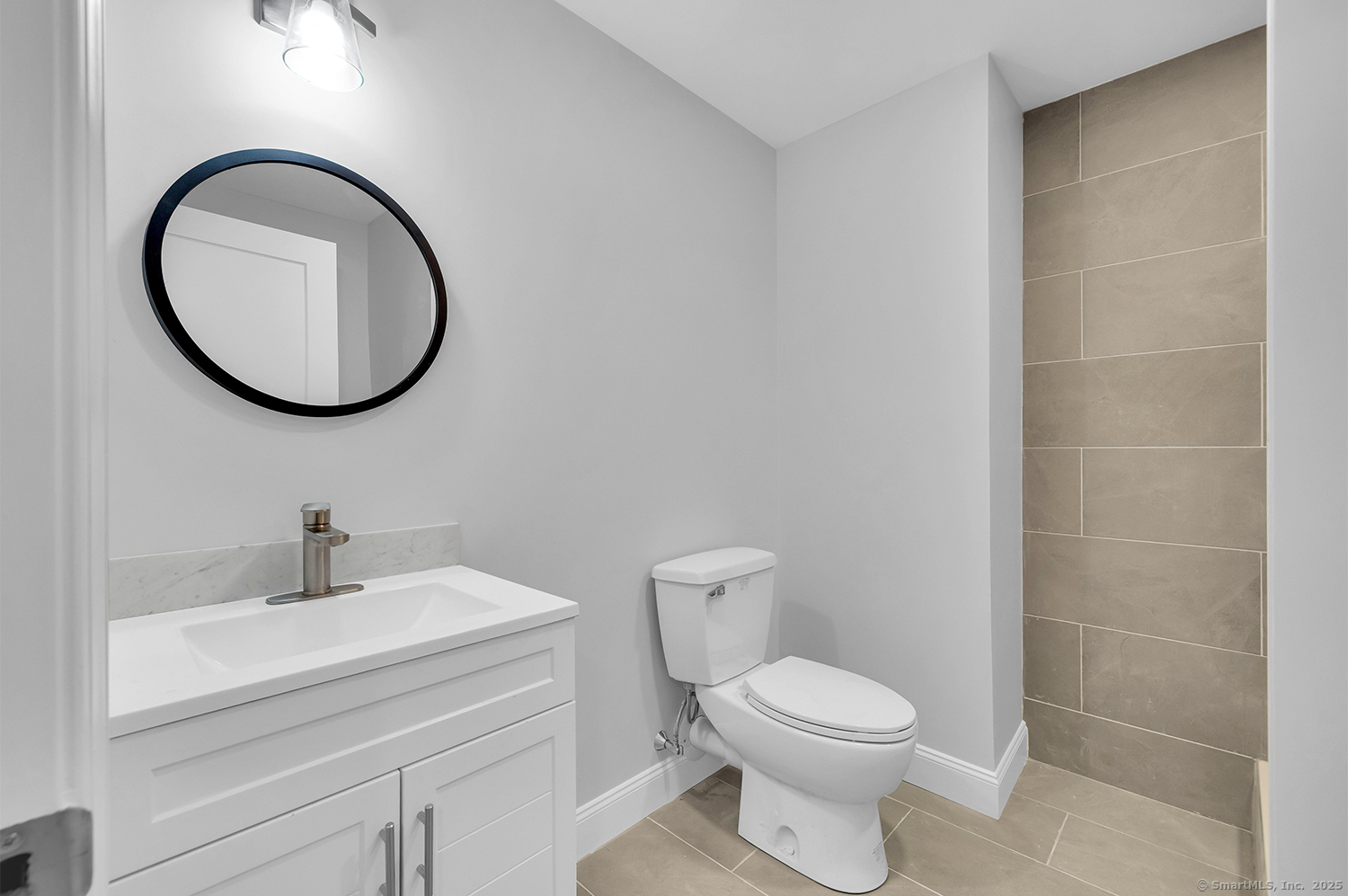 183 Vesper Street Fairfield, CT 06825 - Photo 20 of 21 a bathroom with a toilet a sink and mirror