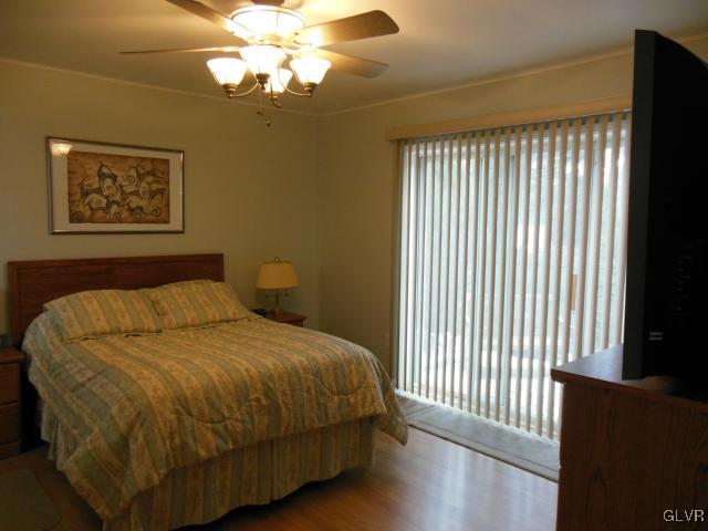 2147 Whitehead Road Nazareth, PA 18064 - Photo 30 of 35 a large bed sitting in a bedroom next to a window