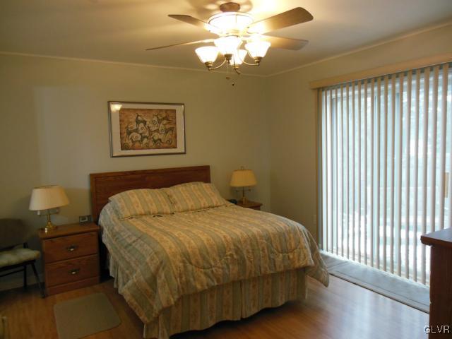 2147 Whitehead Road Nazareth, PA 18064 - Photo 4 of 35 a bedroom with a bed and a chandelier