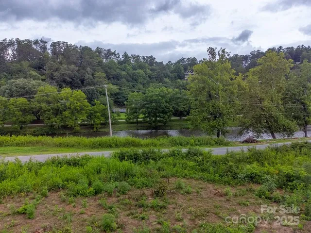 a view of a garden with a building in the background