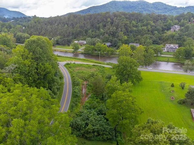 a view of a lake with a big yard