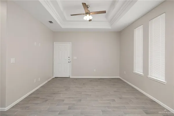 a view of an empty room with a window