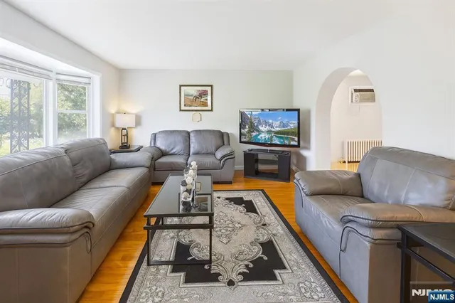 a living room with furniture and a rug