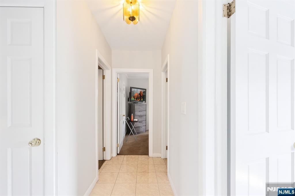 309 Lookout Avenue Hackensack, NJ 07601 - Photo 11 of 25 a view of a bathroom from a hallway