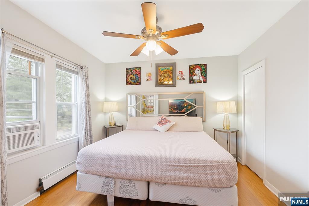 309 Lookout Avenue Hackensack, NJ 07601 - Photo 12 of 25 a bedroom with a bed and a chandelier