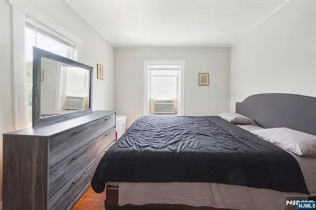 a bedroom with a bed and cabinets