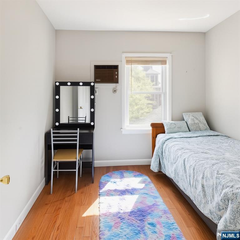 309 Lookout Avenue Hackensack, NJ 07601 - Photo 15 of 25 a bedroom with a bed and a window