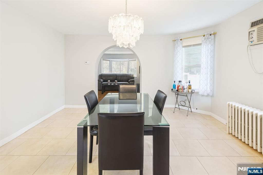 309 Lookout Avenue Hackensack, NJ 07601 - Photo 8 of 25 a dining room with furniture and window