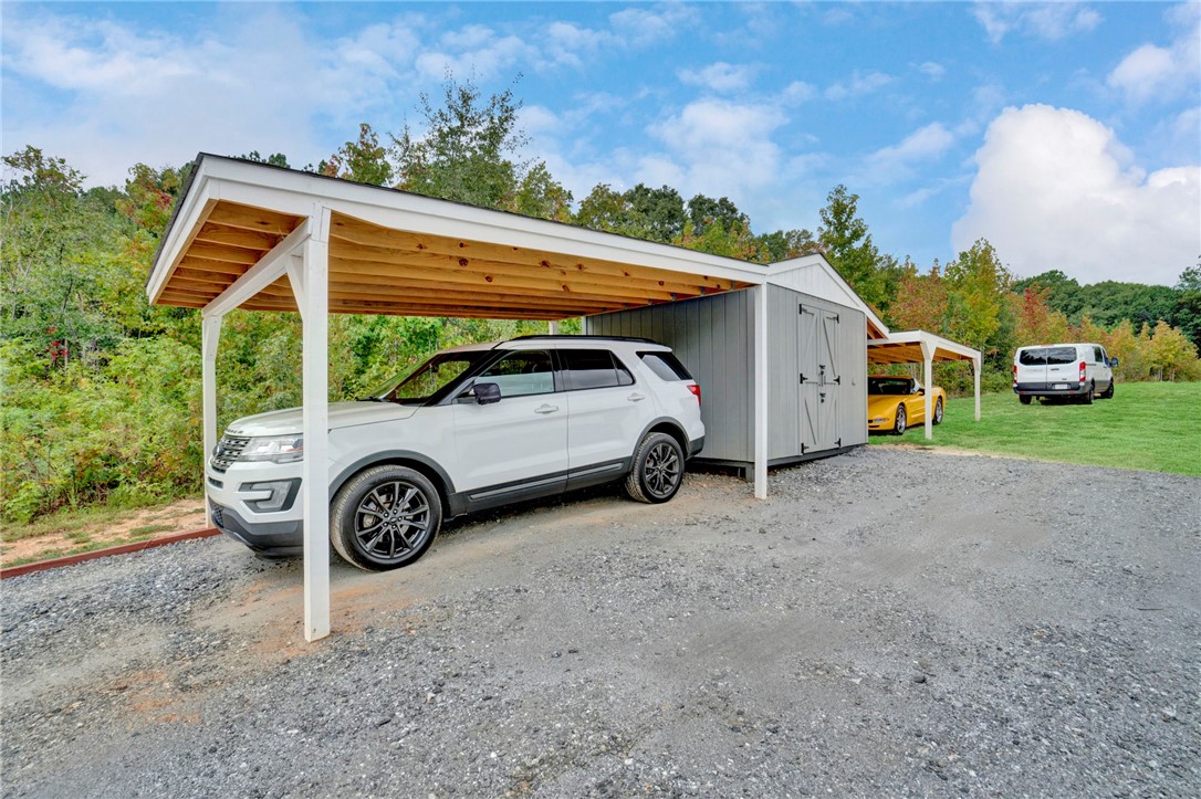 2655 State Rd S-4-108 Anderson, SC 29624 - Photo 32 of 37 Ample parking options are provided by detached open carports and a central storage building.