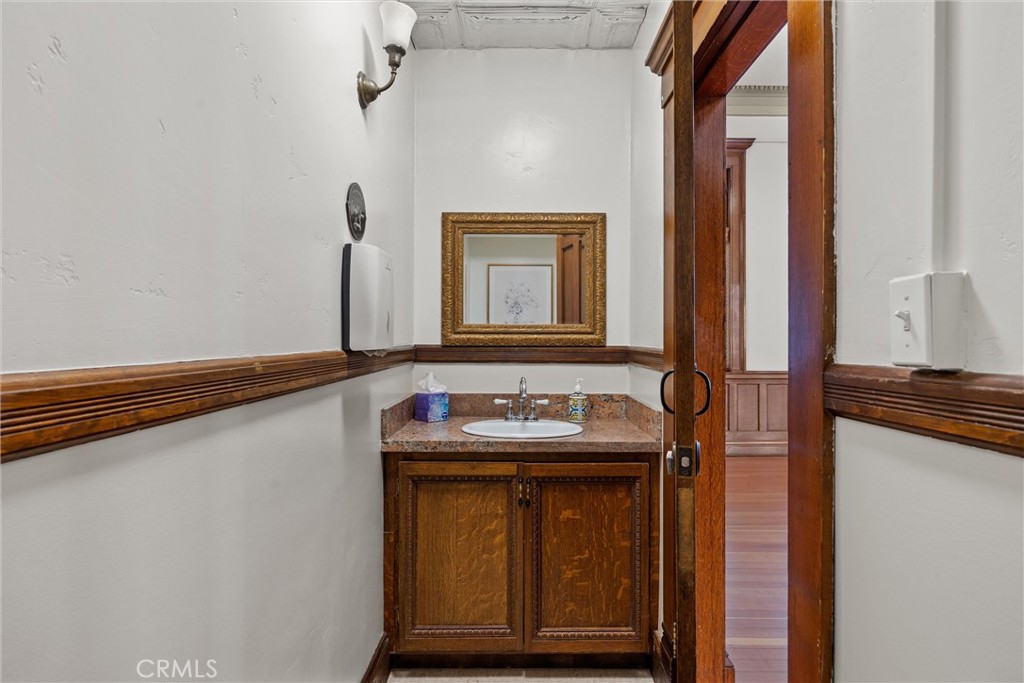 909 Jefferson Street Red Bluff, CA 96080 - Photo 17 of 41 a bathroom with a sink and a mirror