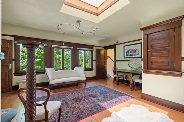 a view of a room with a chairs and table in a room