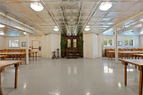 a lobby with furniture and a table