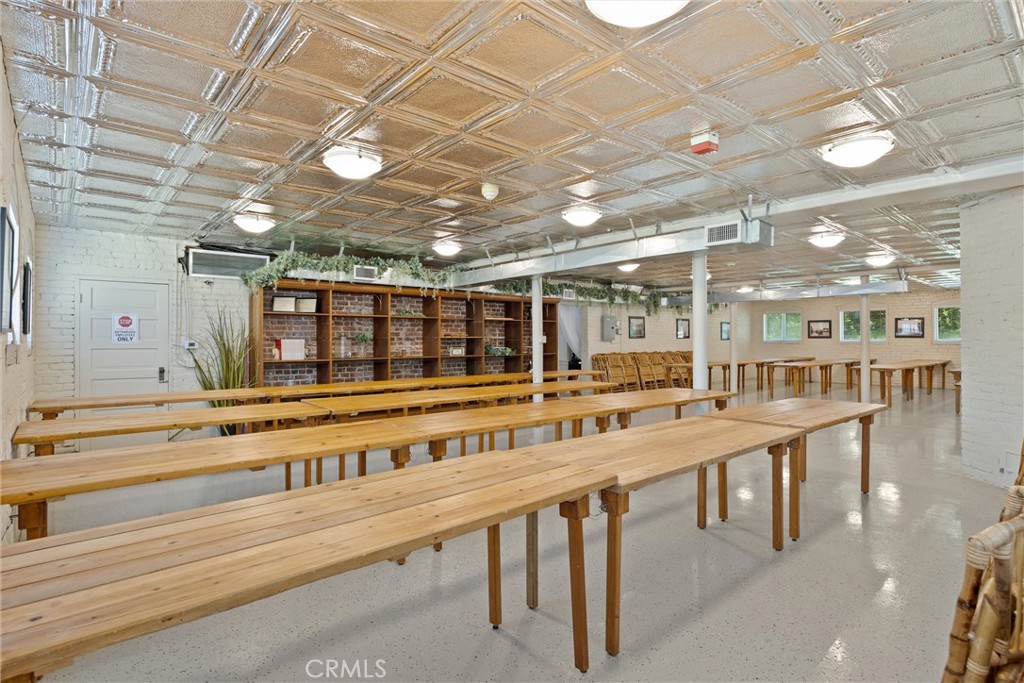 909 Jefferson Street Red Bluff, CA 96080 - Photo 28 of 41 a large room with lots of wooden furniture and a chandelier