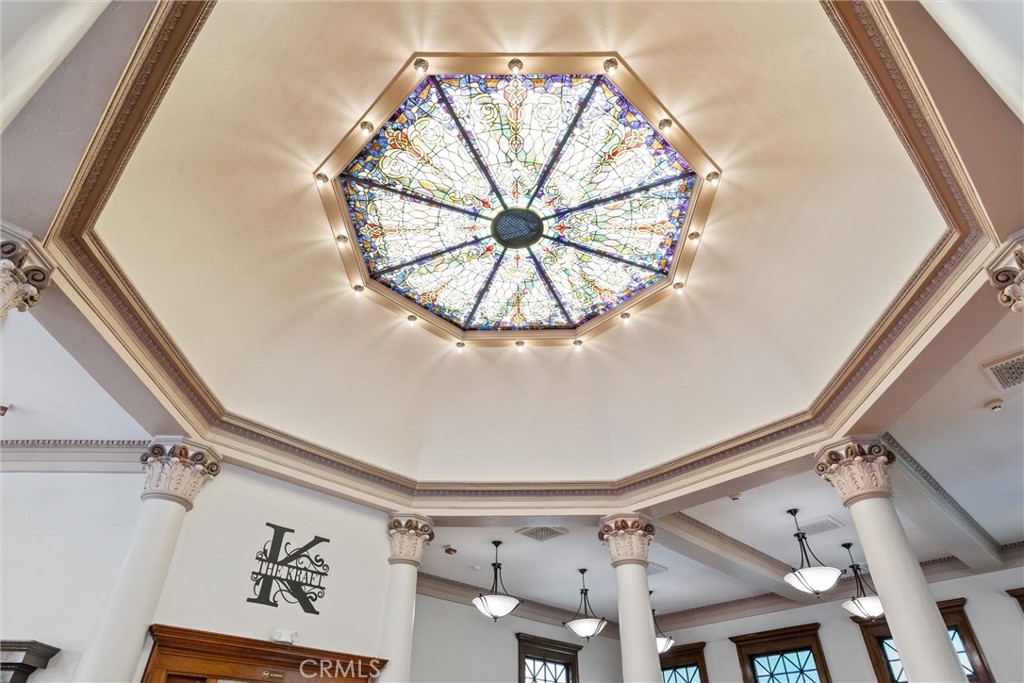 909 Jefferson Street Red Bluff, CA 96080 - Photo 34 of 41 a view of a hallway with a window and a chandelier