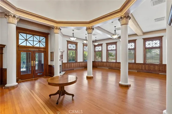 a lobby with furniture and floor to ceiling window