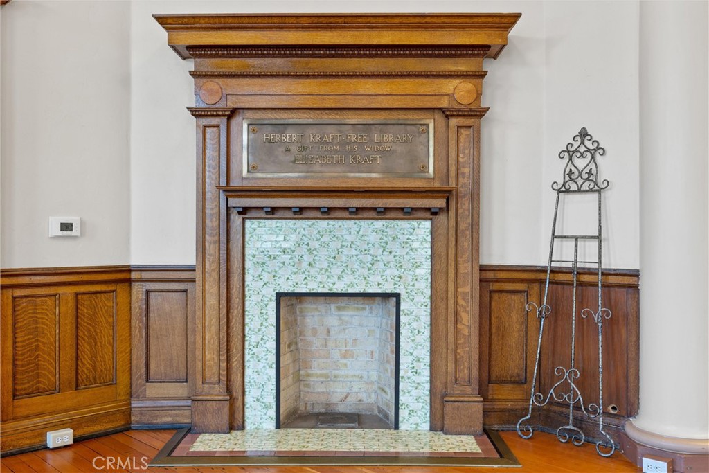 909 Jefferson Street Red Bluff, CA 96080 - Photo 10 of 41 a living room with a fireplace windows and a wooden floor
