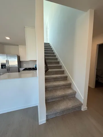 a view of entryway and kitchen
