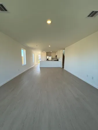 a view of empty room with window and fireplace