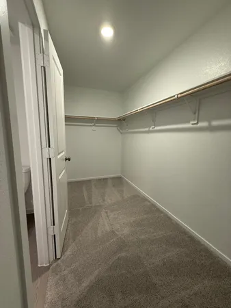 an empty room with a fireplace