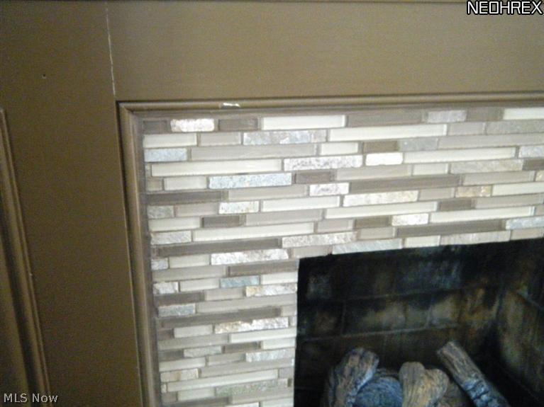 1121 Ford Road Lyndhurst, OH 44124 - Photo 7 of 21 Glass tile around fireplace