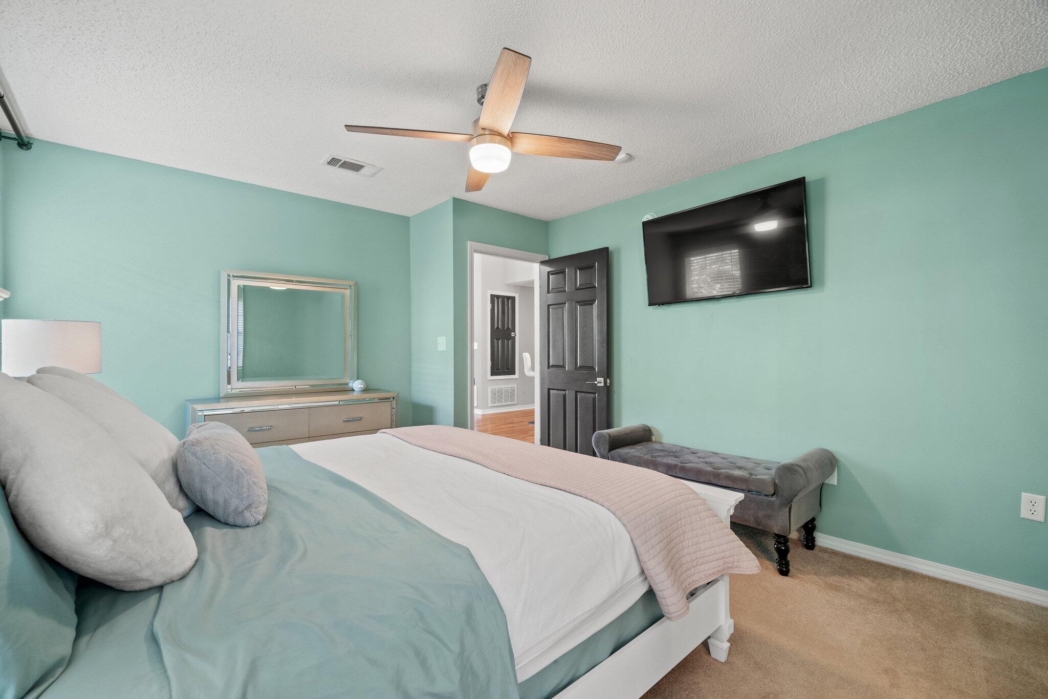 125 Bayou Landing Road Miramar Beach, FL 32550 - Photo 13 of 21 a bedroom with a large bed and a flat screen tv