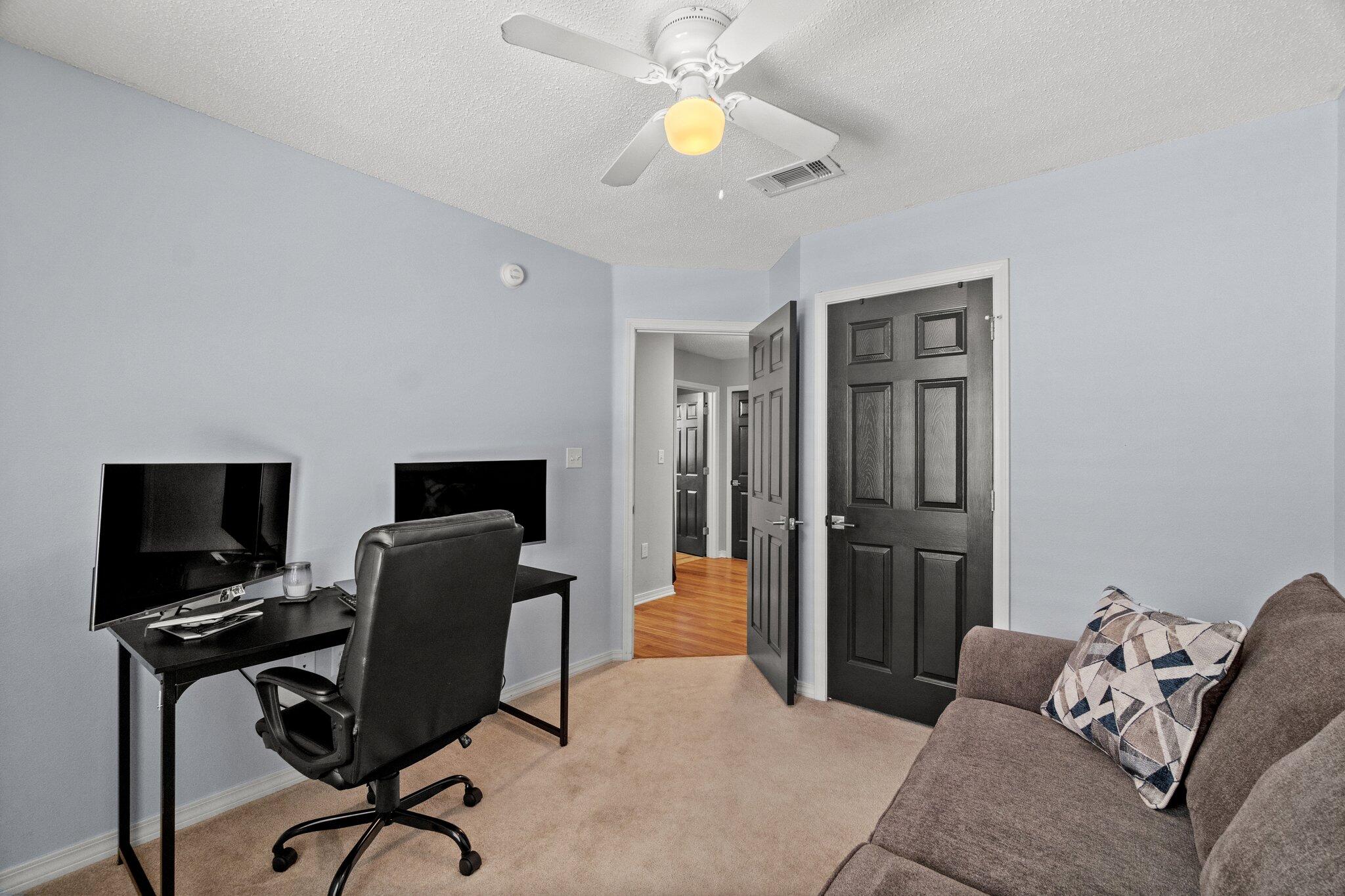 125 Bayou Landing Road Miramar Beach, FL 32550 - Photo 16 of 21 a livingroom with workspace and a couch