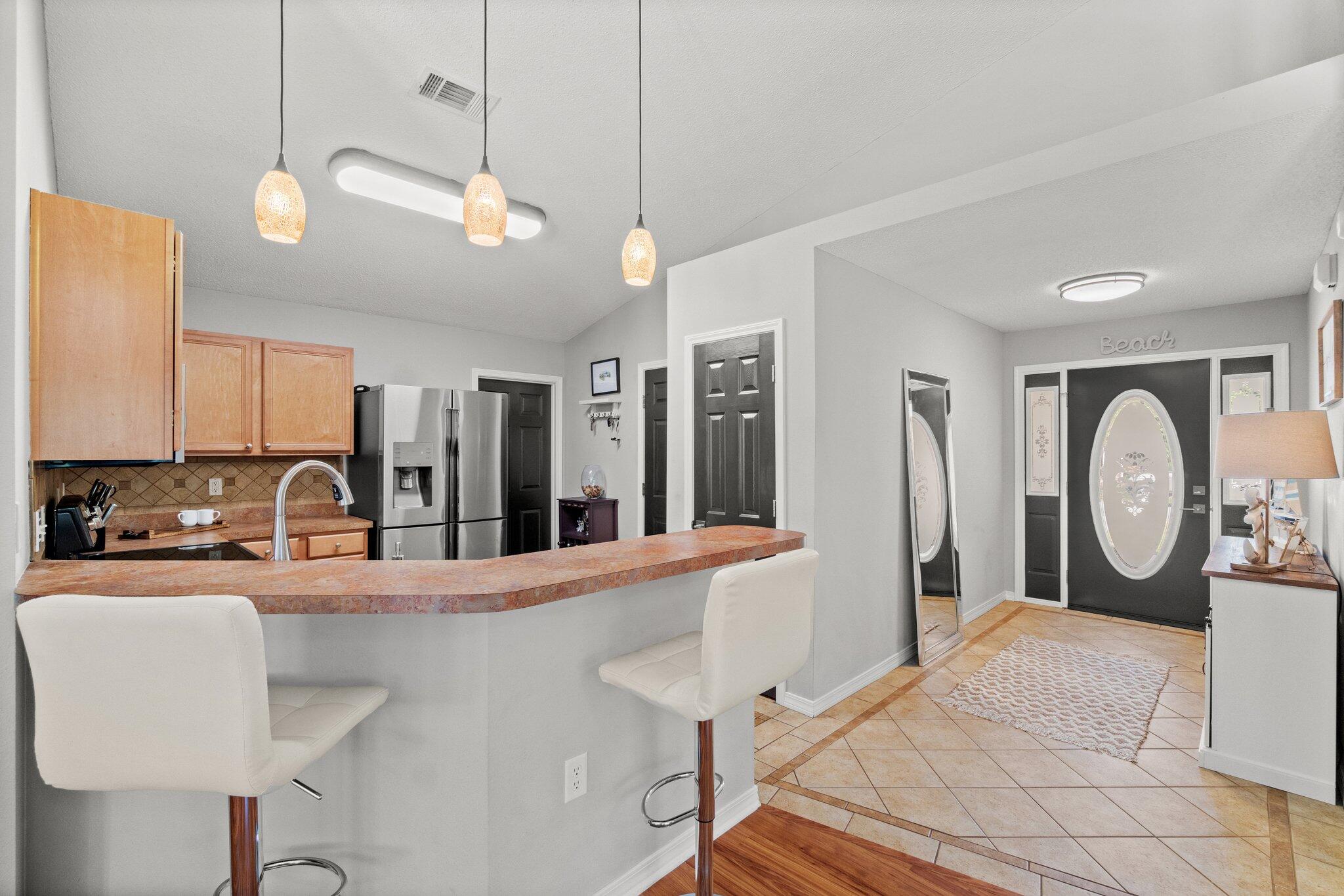 125 Bayou Landing Road Miramar Beach, FL 32550 - Photo 4 of 21 a kitchen with stainless steel appliances granite countertop a sink a stove and a refrigerator