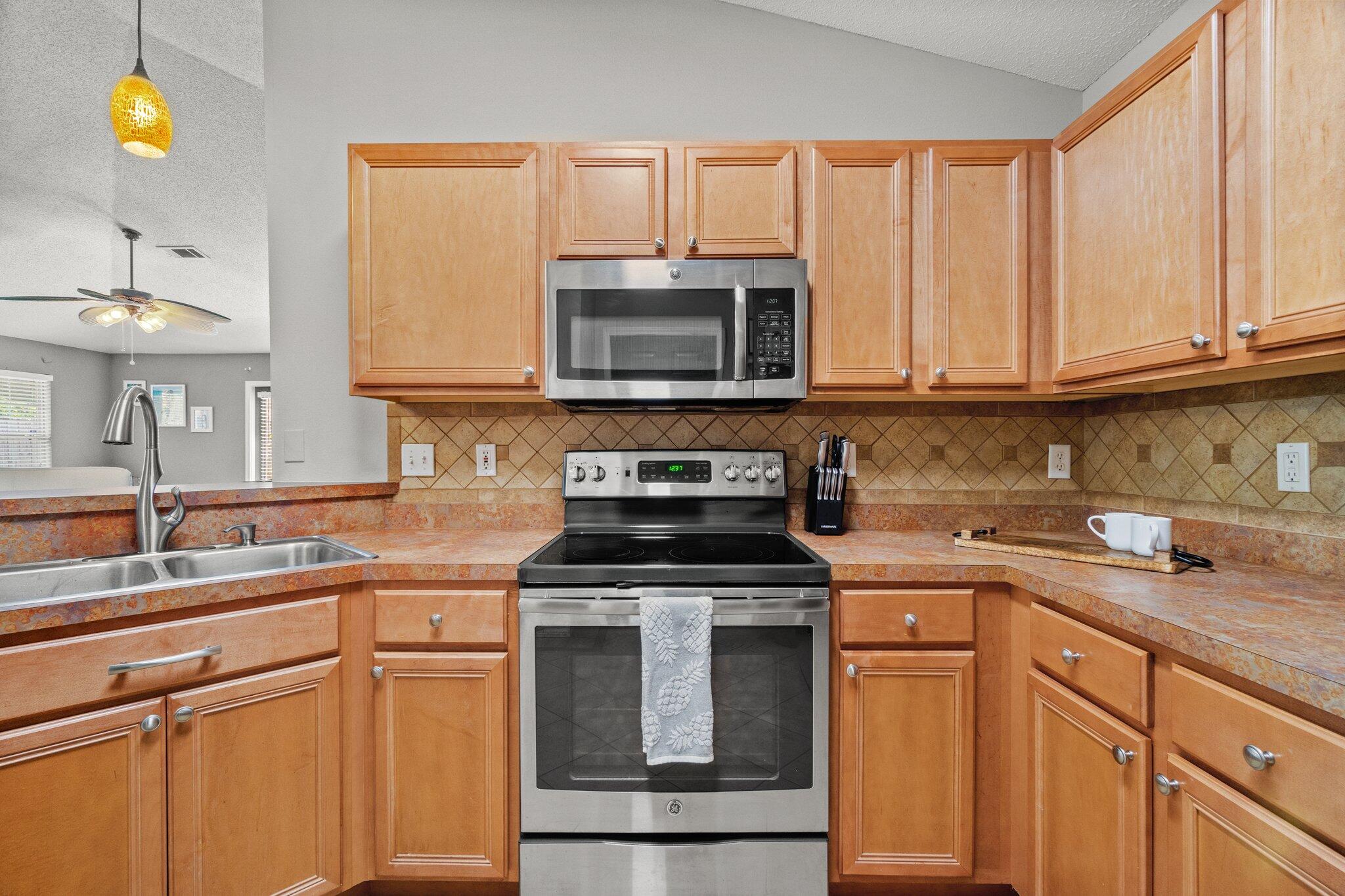 125 Bayou Landing Road Miramar Beach, FL 32550 - Photo 6 of 21 a kitchen with cabinets appliances and a sink