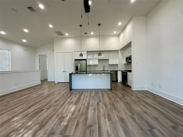 a view of kitchen with wooden floor