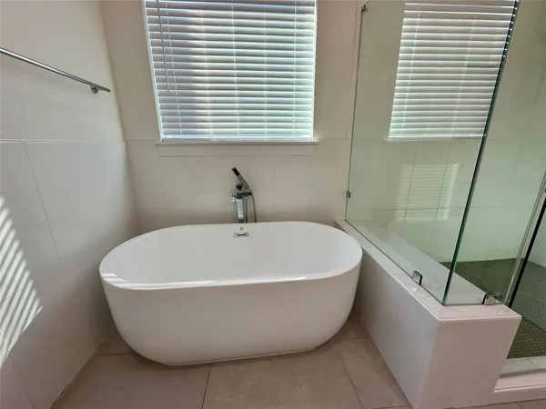 a white bath tub sitting in a bathroom