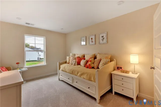 a bed room with a bed and a window