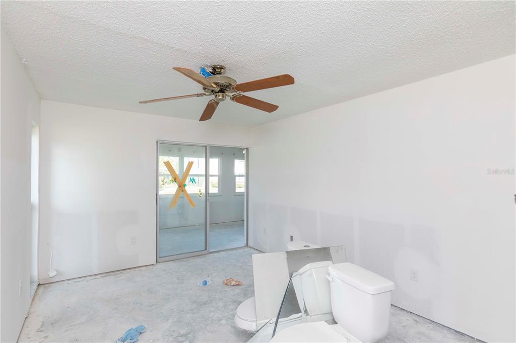 4715 Jasper Drive, Unit 107 New Port Richey, FL 34652 - Photo 13 of 22 a bathroom with a bathtub and a shower