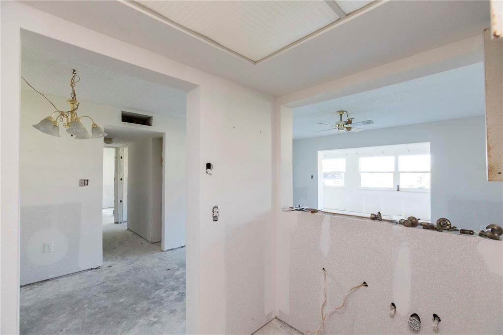 4715 Jasper Drive, Unit 107 New Port Richey, FL 34652 - Photo 8 of 22 wooden floor and window in a room