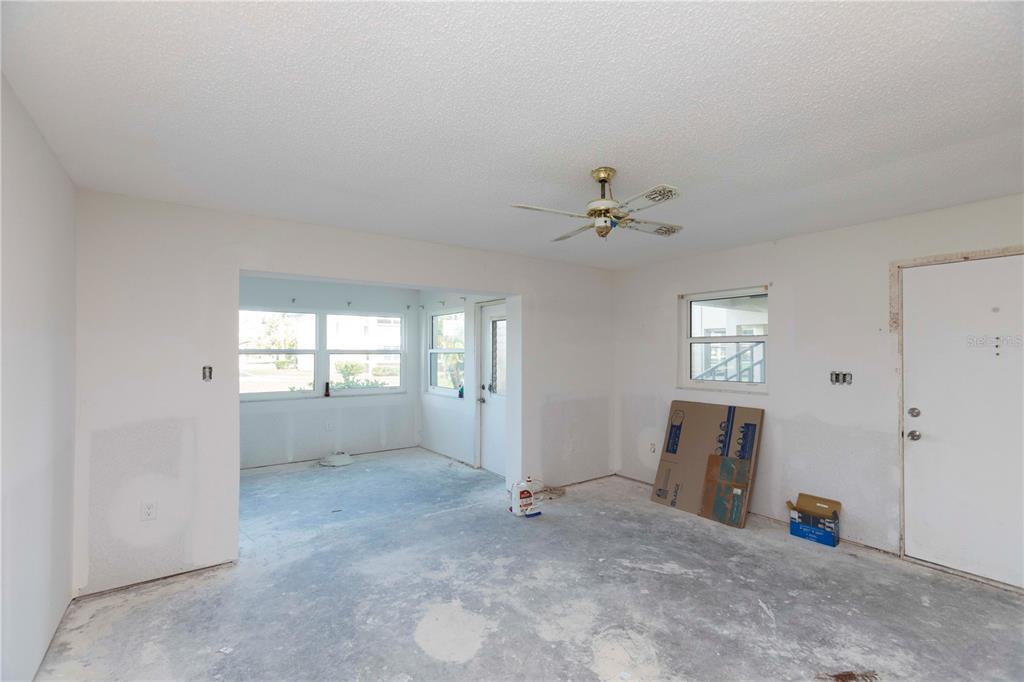 4715 Jasper Drive, Unit 107 New Port Richey, FL 34652 - Photo 9 of 22 an empty room with windows and closet