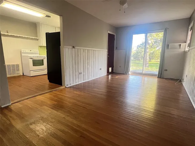 a view of a livingroom with wooden floor
