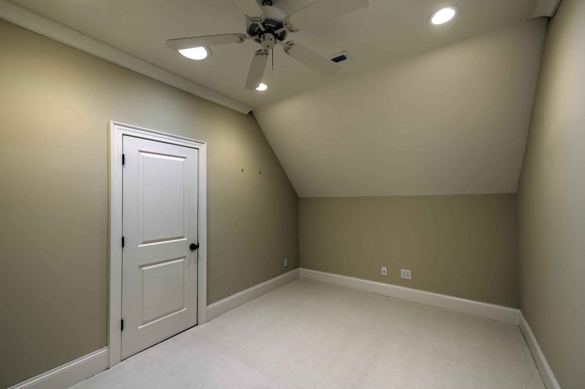 1417 Caistor Lane Raleigh, NC 27614 - Photo 32 of 42 This finished space off the bonus room is perfect for a second home office or perhaps seasonal clothing storage or a virtual golf room!