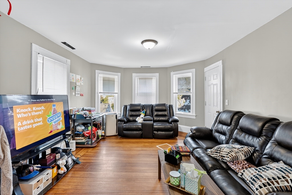 24-26 Pendleton Street Cranston, RI 02920 - Photo 15 of 25 a living room with furniture and a flat screen tv