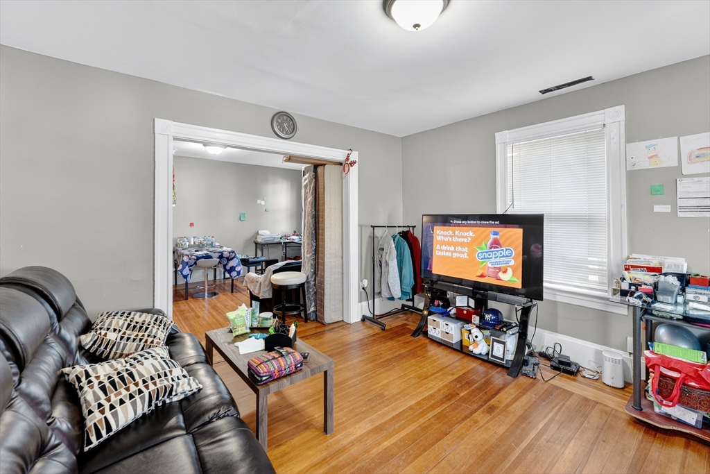 24-26 Pendleton Street Cranston, RI 02920 - Photo 16 of 25 a living room with furniture and a flat screen tv