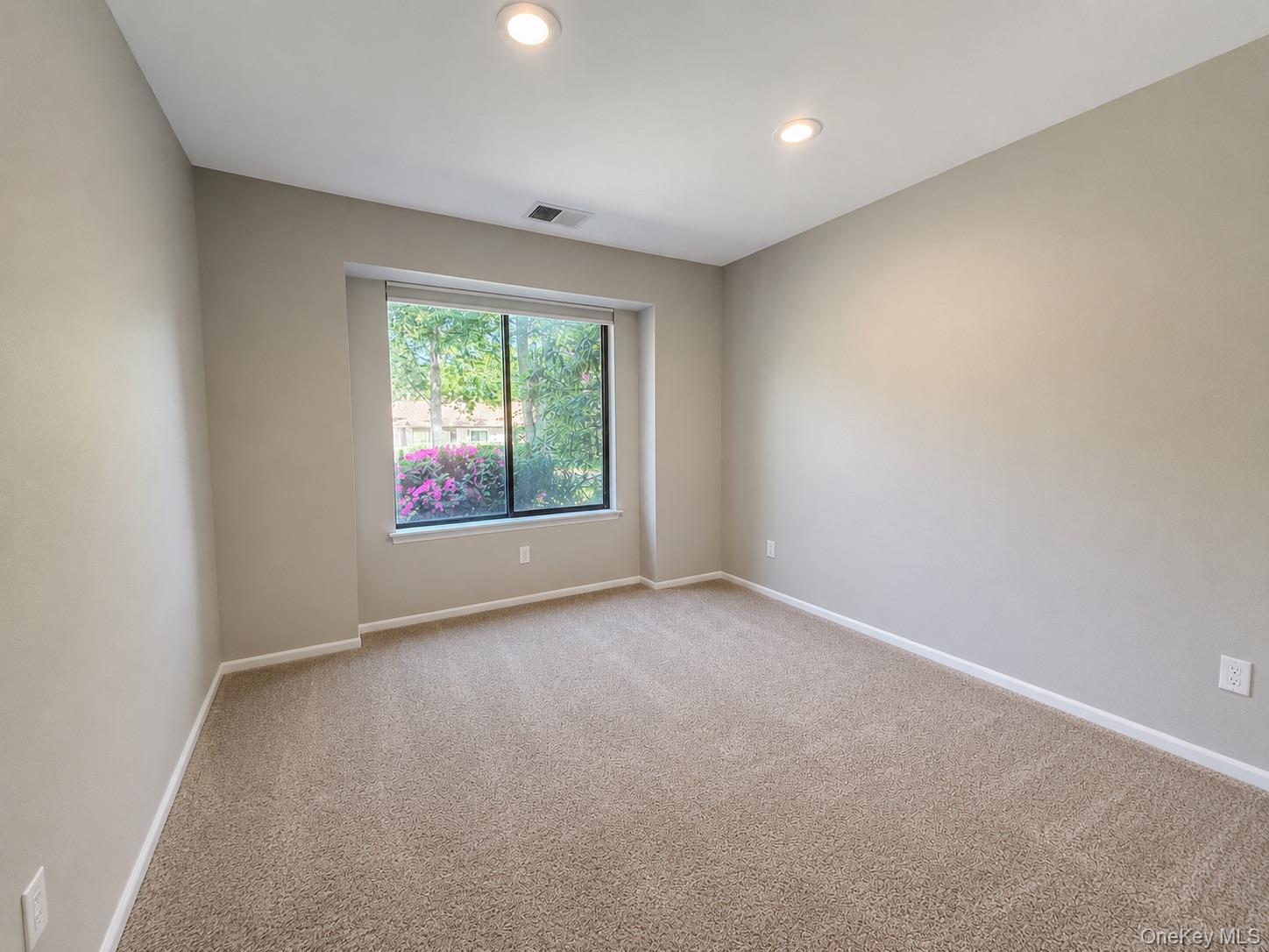 201 Birchwood Road, Unit 201 Coram, NY 11727 - Photo 18 of 27 an empty room with windows