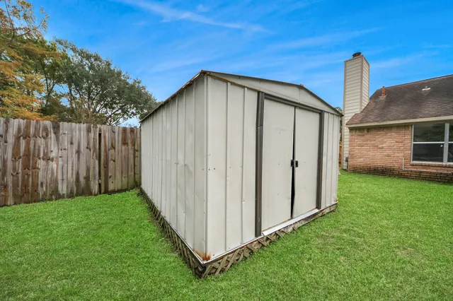 a table and chairs sitting in the grass