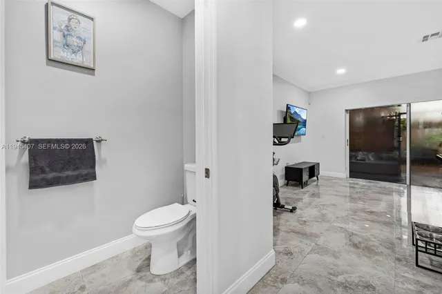 a living room with a couch and a flat screen tv